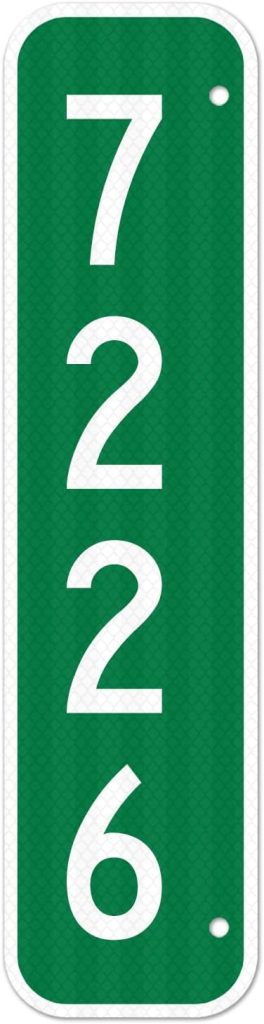 A vertical green rectangular sign with the white numbers "7226" displayed in large font. The sign has rounded corners and two holes at the top and bottom for mounting.